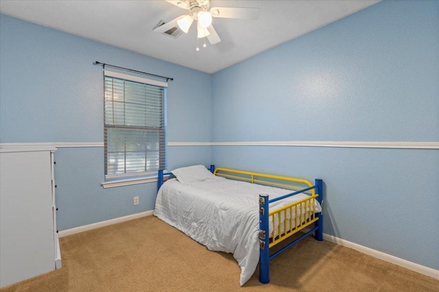 110 Hummingbird Ct, Cedar Creek, TX 78612 - bedroom featuring carpet, baseboards, and a ceiling fan