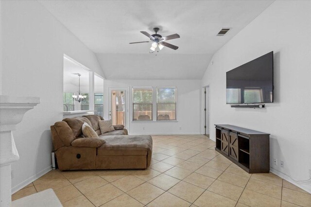 110 Hummingbird Ct, Cedar Creek, TX 78612 - living area with a chandelier, lofted ceiling, a ceiling fan, light tile patterned flooring, and baseboards