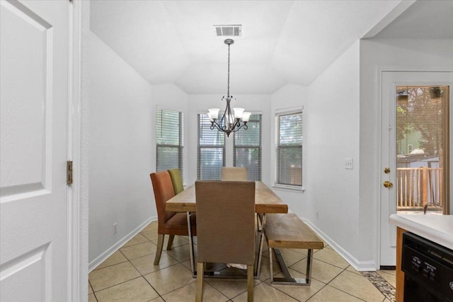110 Hummingbird Ct, Cedar Creek, TX 78612 - dining area featuring light tile patterned floors, a chandelier, plenty of natural light, lofted ceiling, and baseboards