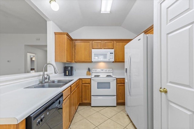 110 Hummingbird Ct, Cedar Creek, TX 78612 - kitchen featuring white appliances, a sink, vaulted ceiling, light countertops, and light tile patterned floors