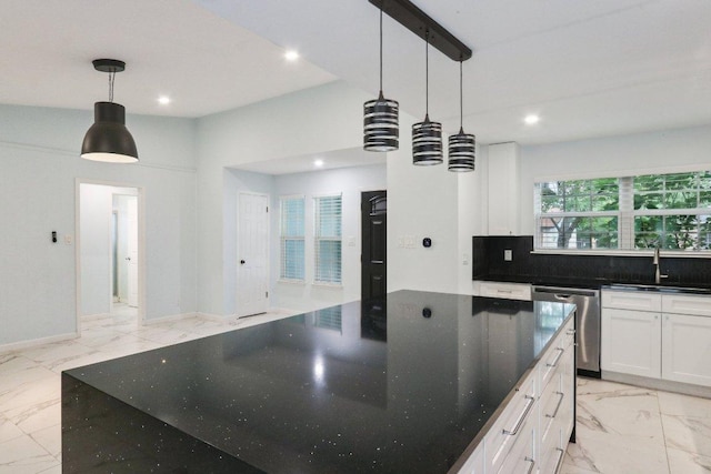 309 Northwood Dr, Georgetown, TX 78628 - kitchen featuring dishwasher, light marble finish flooring, recessed lighting, white cabinetry, and a large island