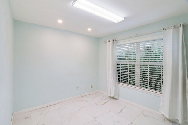 309 Northwood Dr, Georgetown, TX 78628 - spare room with marble finish floors and recessed lighting