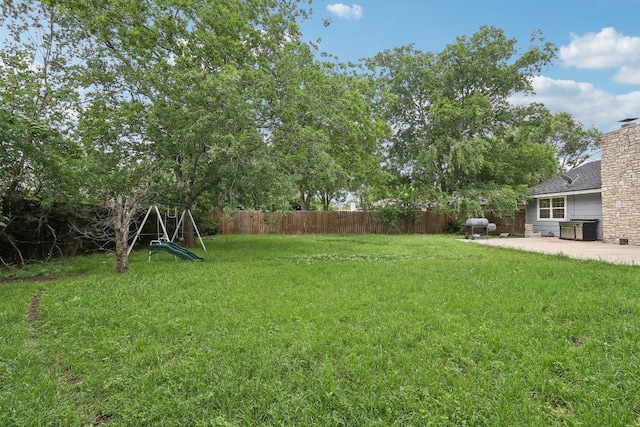 309 Northwood Dr, Georgetown, TX 78628 - fenced backyard with a patio area