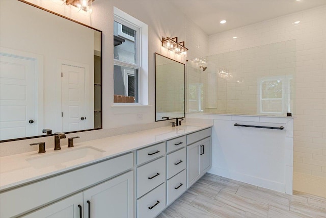 1352 S Brook Dr, Leander, TX 78641 - full bath featuring double vanity, a walk in shower, and recessed lighting