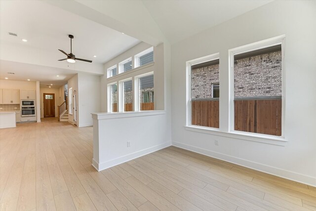 1352 S Brook Dr, Leander, TX 78641 - unfurnished room with ceiling fan, light wood-style floors, stairway, and recessed lighting