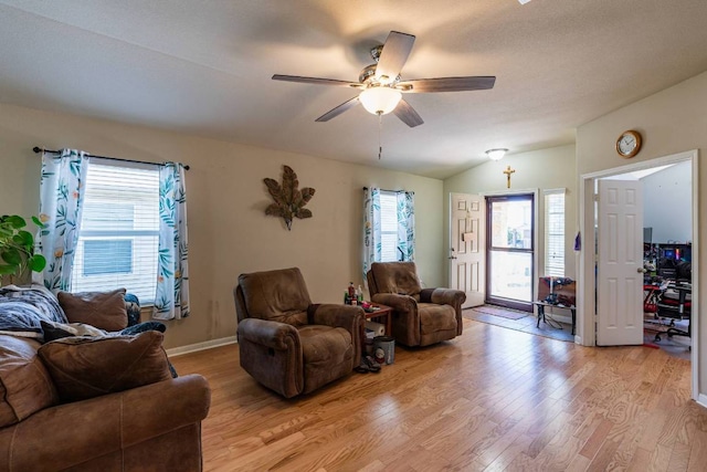604 Comal Run, Hutto, TX 78634 - living room featuring light wood-type flooring, healthy amount of natural light, a ceiling fan, and lofted ceiling