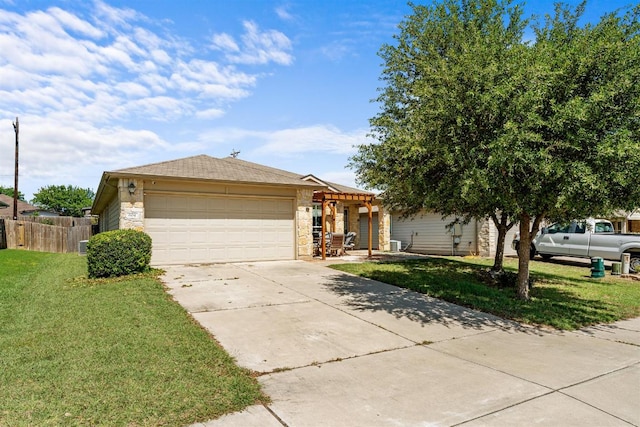604 Comal Run, Hutto, TX 78634 - view of front of home featuring stone siding, a pergola, concrete driveway, and a garage