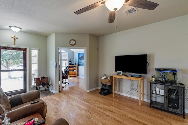 604 Comal Run, Hutto, TX 78634 - living room with light wood-style floors and a ceiling fan
