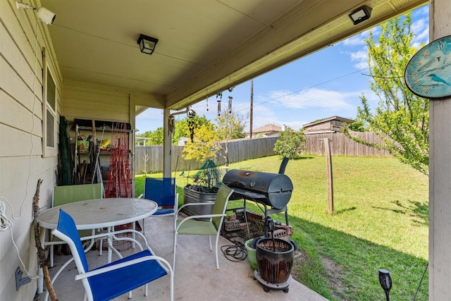 604 Comal Run, Hutto, TX 78634 - fenced backyard featuring a patio area and area for grilling