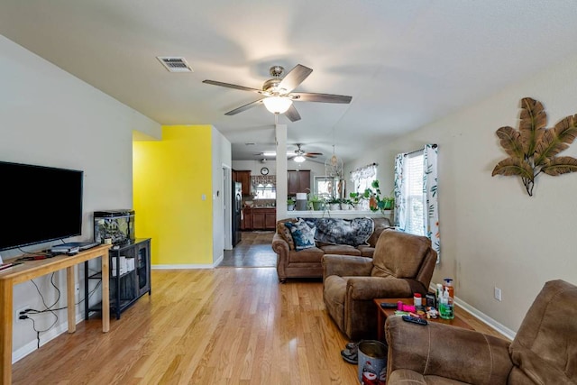 604 Comal Run, Hutto, TX 78634 - living room featuring light wood-type flooring and ceiling fan