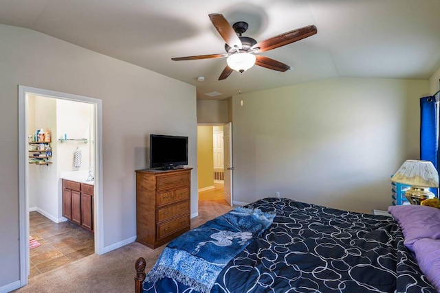 604 Comal Run, Hutto, TX 78634 - bedroom with vaulted ceiling, ensuite bath, light carpet, and a ceiling fan