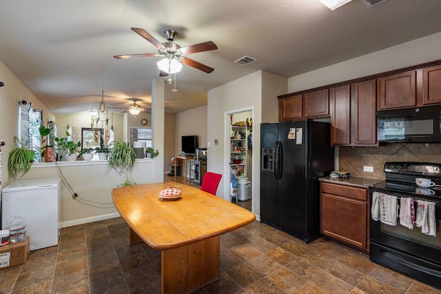 604 Comal Run, Hutto, TX 78634 - kitchen with black appliances, ceiling fan, decorative backsplash, and dark stone finish flooring