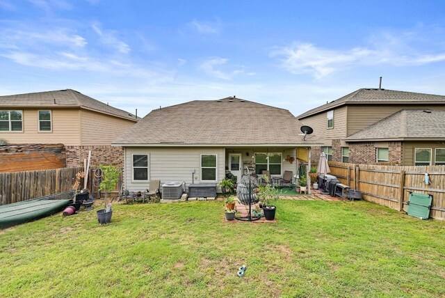 rear view of property with central AC and a patio