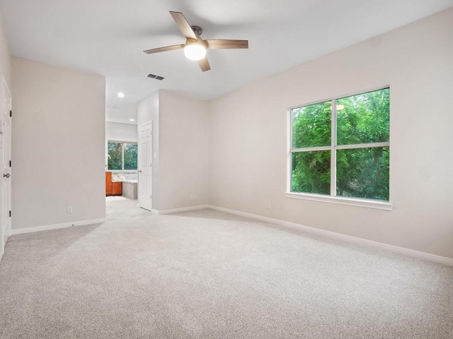 9402 Bluegrass Dr, Austin, TX 78759 - spare room with a ceiling fan, light carpet, and recessed lighting