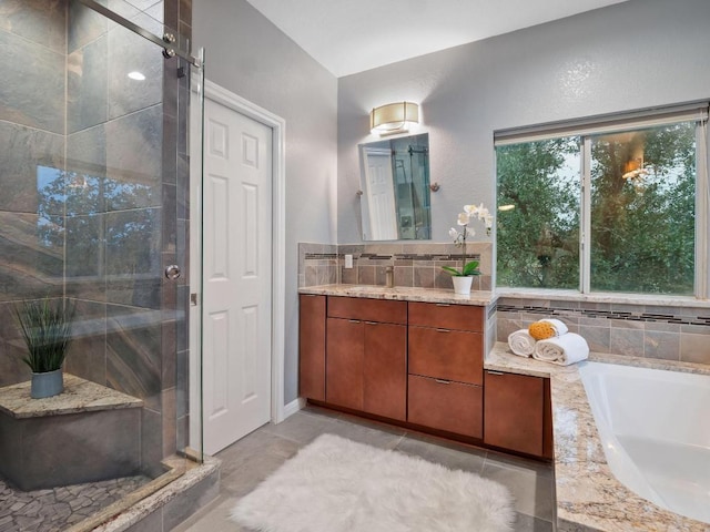 9402 Bluegrass Dr, Austin, TX 78759 - full bathroom with a garden tub, a shower stall, and vanity