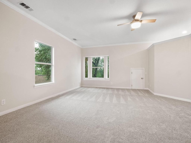 9402 Bluegrass Dr, Austin, TX 78759 - spare room featuring ornamental molding, healthy amount of natural light, light colored carpet, and ceiling fan