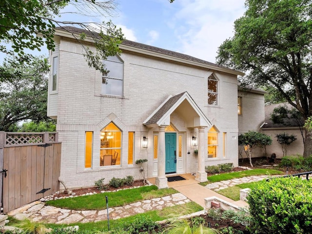 9402 Bluegrass Dr, Austin, TX 78759 - view of front of home featuring brick siding, fence, and a gate