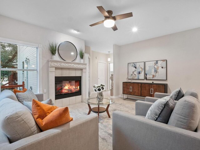 9402 Bluegrass Dr, Austin, TX 78759 - living room featuring ceiling fan, wood finished floors, and a tile fireplace
