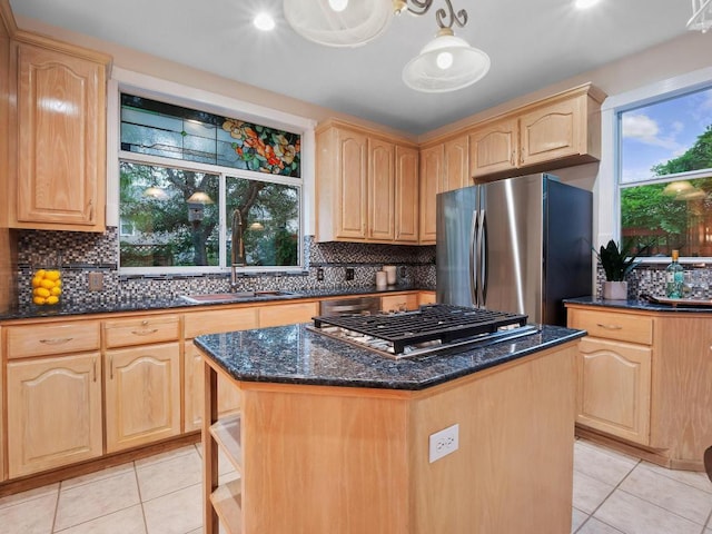 9402 Bluegrass Dr, Austin, TX 78759 - kitchen featuring appliances with stainless steel finishes, light brown cabinetry, and light tile patterned flooring