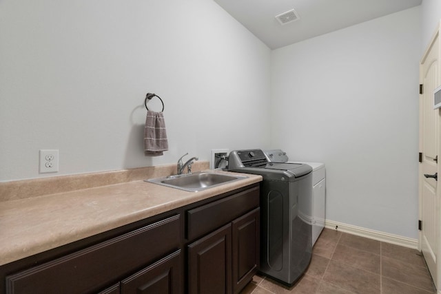 630 Wild Rose Dr, Austin, TX 78737 - washroom with washer and dryer, cabinet space, and tile patterned flooring
