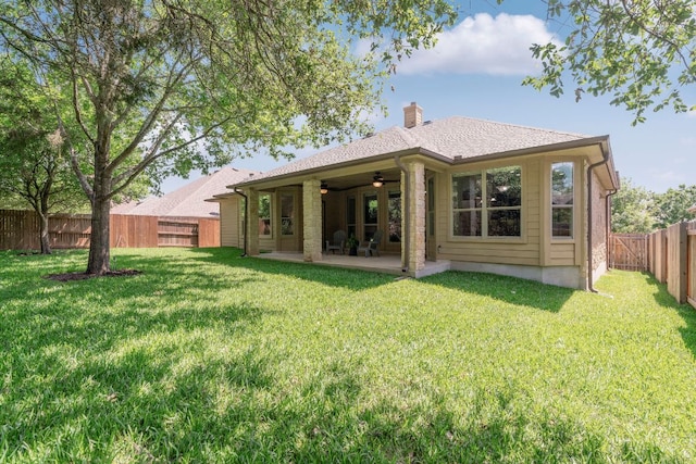 630 Wild Rose Dr, Austin, TX 78737 - back of house featuring ceiling fan, a patio, a fenced backyard, and a chimney