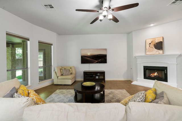 630 Wild Rose Dr, Austin, TX 78737 - living room featuring a ceiling fan, tile patterned flooring, and a lit fireplace