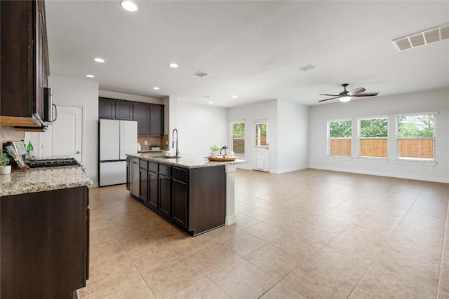 kitchen featuring a sink, appliances with stainless steel finishes, dark brown cabinetry, recessed lighting, and ceiling fan