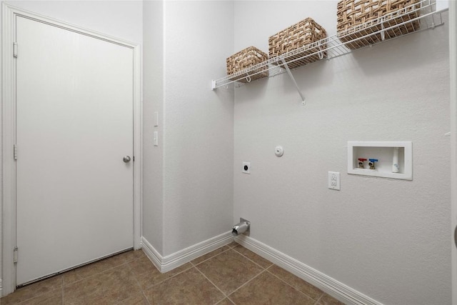 clothes washing area featuring electric dryer hookup, baseboards, washer hookup, tile patterned flooring, and gas dryer hookup