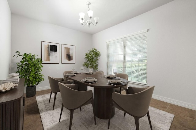 dining area featuring a chandelier and baseboards