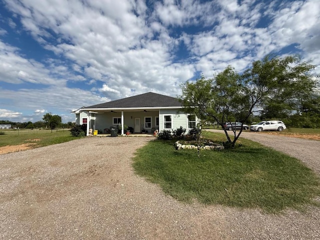 497 Brown Rd, Mcdade, TX 78650 - bungalow-style house featuring driveway, a ceiling fan, and a front lawn