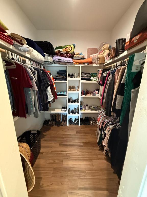 497 Brown Rd, Mcdade, TX 78650 - walk in closet with wood finished floors