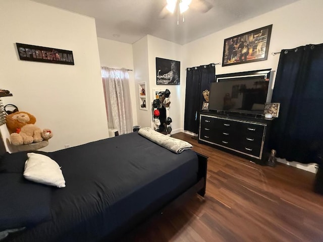 497 Brown Rd, Mcdade, TX 78650 - bedroom featuring dark wood-style flooring and a ceiling fan