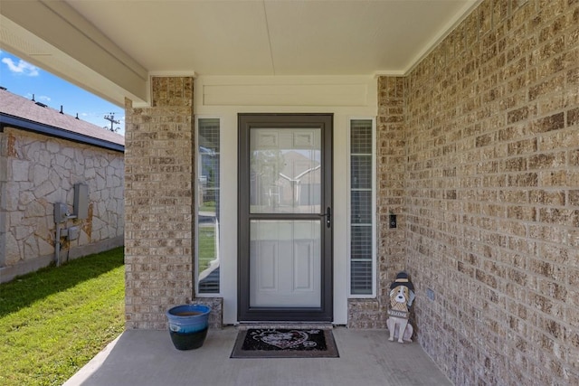 204 Mossberg Ln, Bastrop, TX 78602 - doorway to property with brick siding