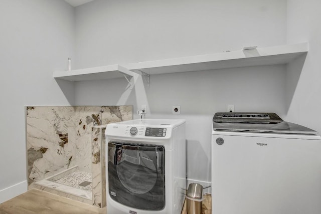 laundry area featuring washing machine and dryer