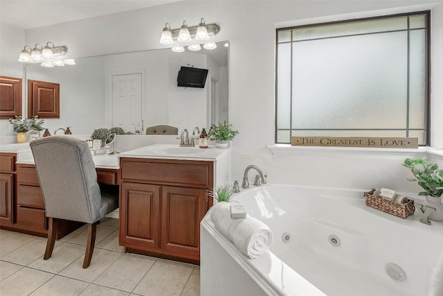 full bathroom featuring plenty of natural light, tile patterned flooring, a jetted tub, and vanity