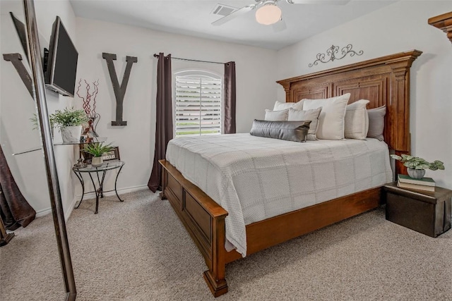 bedroom featuring light carpet, ceiling fan, and baseboards