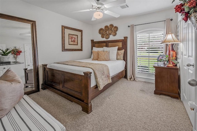 bedroom featuring light carpet and ceiling fan