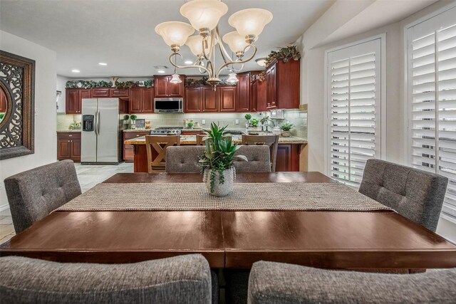 dining room with a chandelier