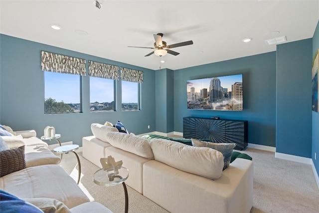 1300 Shelby Ln, Georgetown, TX 78628 - living room with a ceiling fan, carpet, baseboards, and recessed lighting