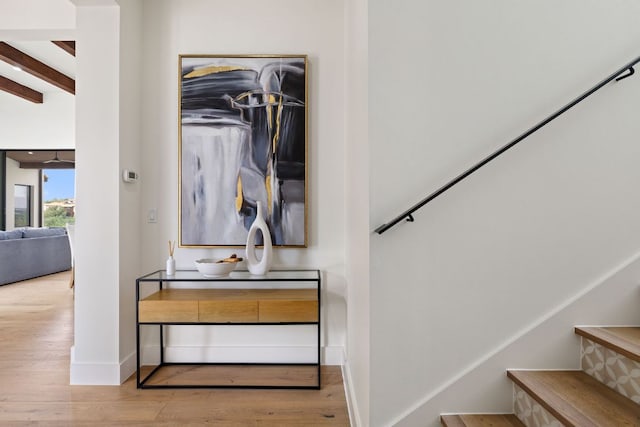 12625 Maidenhair Ln Unit 31, Austin, TX 78738 - stairs with beamed ceiling, wood finished floors, and baseboards