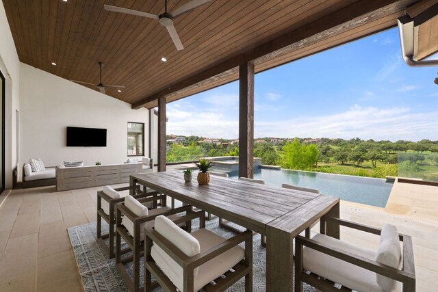 12625 Maidenhair Ln Unit 31, Austin, TX 78738 - view of patio / terrace featuring ceiling fan, outdoor dining area, and an infinity pool