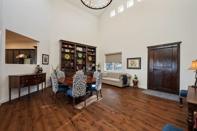 124 Hoskins Trl, Boerne, TX 78006 - dining space with high vaulted ceiling, wood finished floors, a chandelier, and baseboards