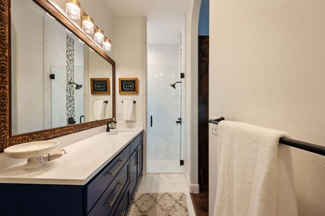 124 Hoskins Trl, Boerne, TX 78006 - bathroom featuring double vanity, a marble finish shower, and marble finish floors