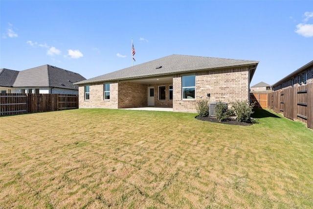 552 Tekoa Dr, Georgetown, TX 78628 - back of property featuring brick siding and a patio area