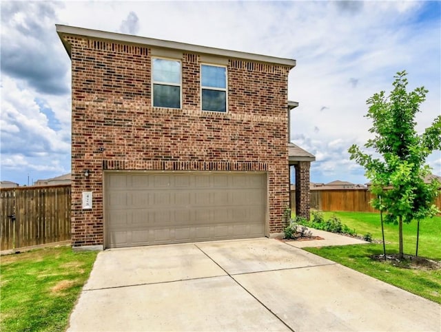 traditional-style home featuring brick siding, driveway, and a garage