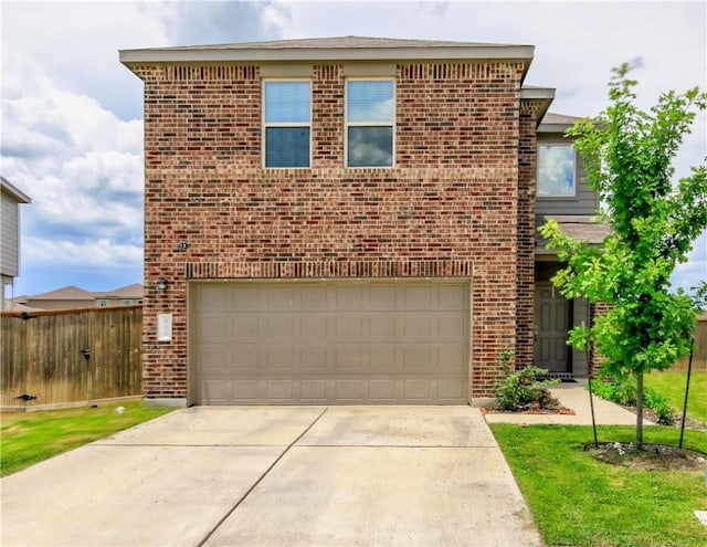 traditional home featuring brick siding, driveway, a garage, and fence