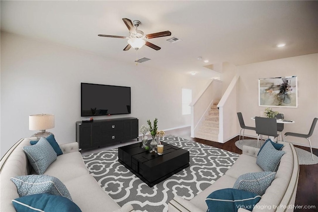 living room featuring stairs, ceiling fan, recessed lighting, wood finished floors, and baseboards