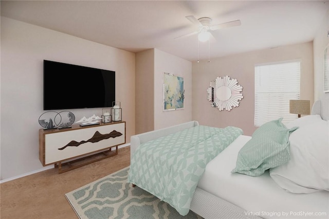 bedroom featuring ceiling fan and baseboards