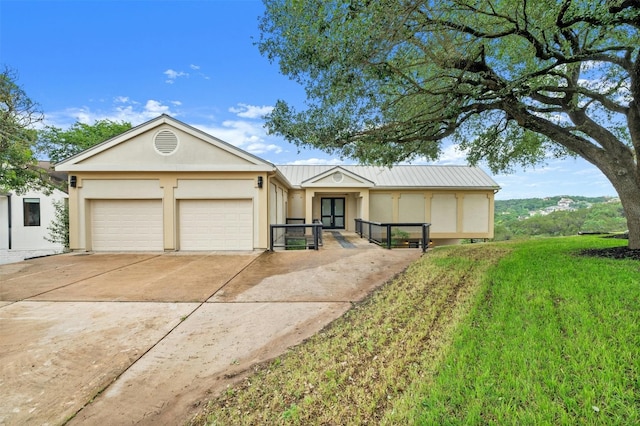 5801 Cannonade Ct, Austin, TX 78746 - ranch-style home with an attached garage, driveway, stucco siding, and a metal roof