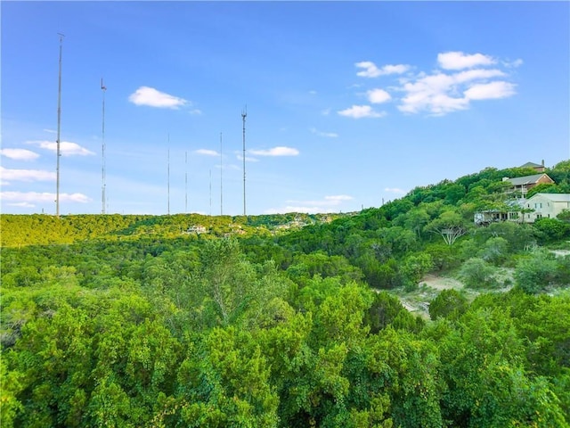 5801 Cannonade Ct, Austin, TX 78746 - view of mountain backdrop with a heavily wooded area